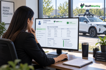 Autonomous vehicle recruiting specialist reviewing a candidate driving record